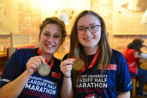 cadwaladers cardiff half marathon runners with medals
